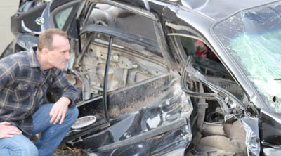 Attorney Eric Hageman Inspects Car