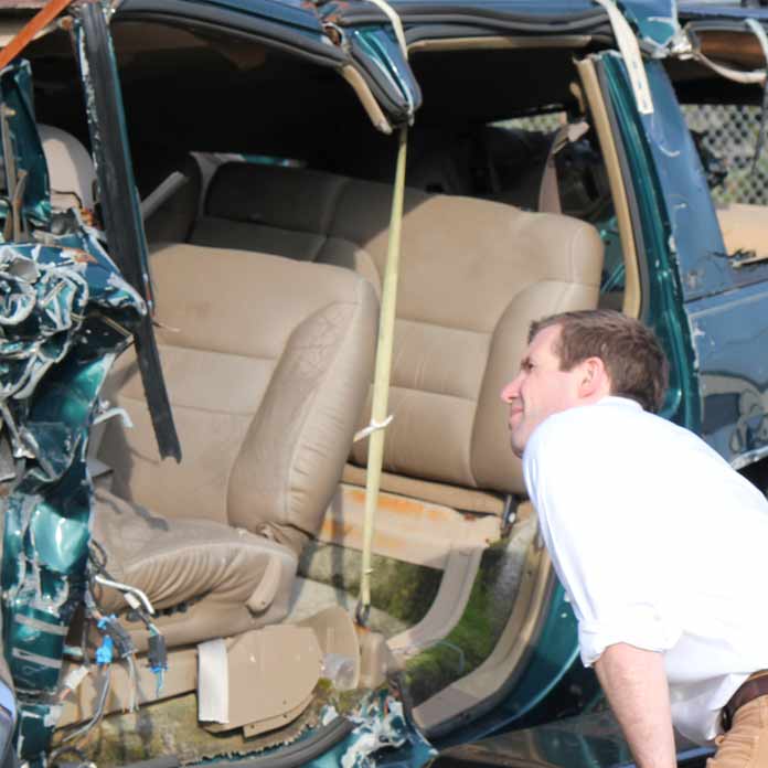 Crash Lawyer Inspects Vehicle
