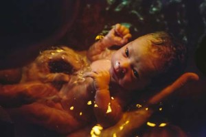 newborn baby in water birth bath