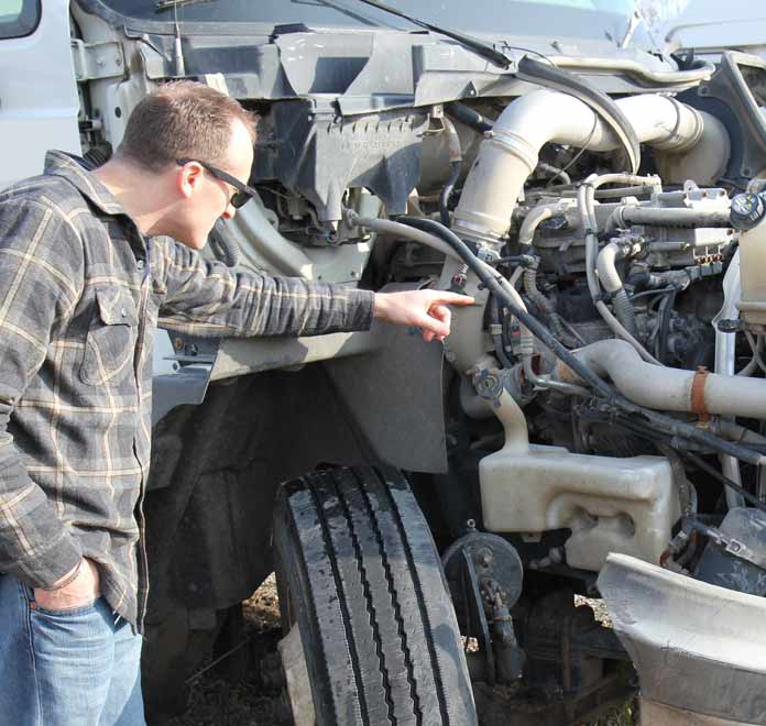 Attorney Eric Hageman Inspects Semi Truck after Crash