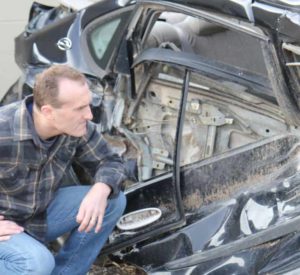 Attorney Inspecting Car after Wreck