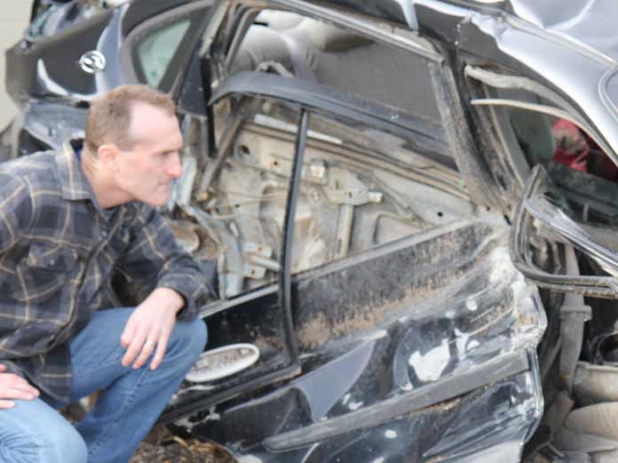 Lawyer Inspects Car after Crash