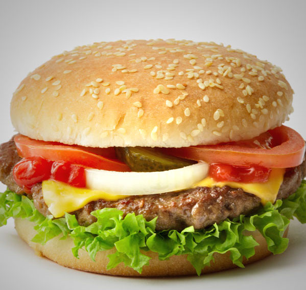 Cheeseburger with lettuce, tomato, onion, pickles ketchup, sesame seed bun