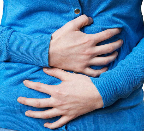 Salmonella lawyer woman clutching abdomen