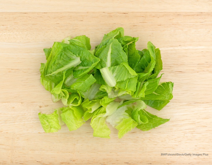 Listeria Lawyer- cut romaine lettuce on wood board