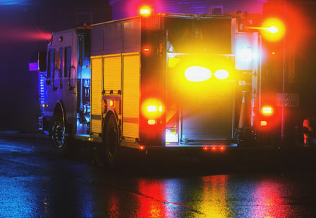 Fire Attorney -fire truck at night on wet street