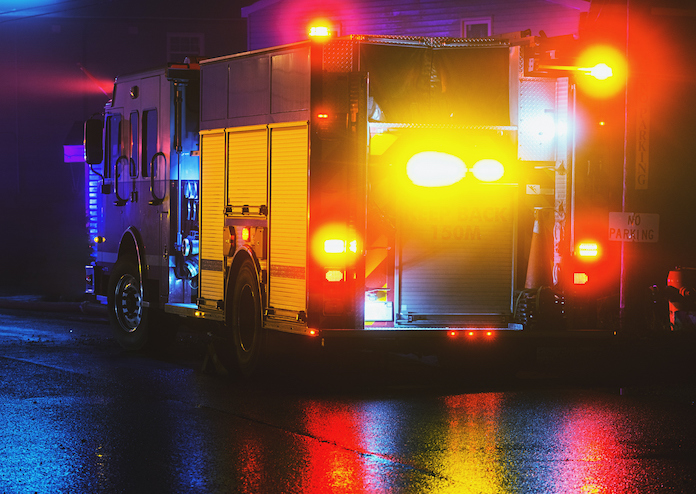 Fire Attorney -fire truck at night on wet street