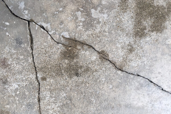 Cracks in the concrete wall of a structure