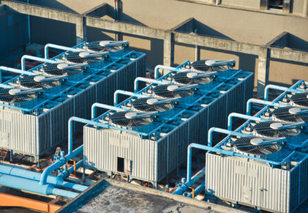 Cooling tower on roof top of building. Industrial air cooling system. Air chiller. Unit of air conditioner.