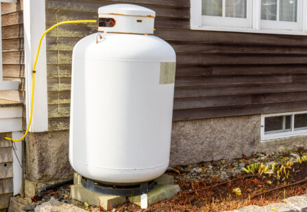 Propane tank in front of a house in Maine