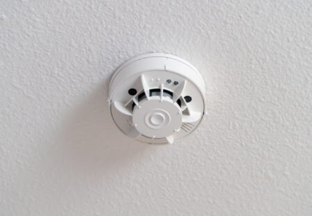 Smoke detector alarm on ceiling