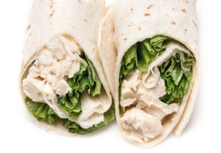 Chicken salad wraps with lettuce in flour tortillas.