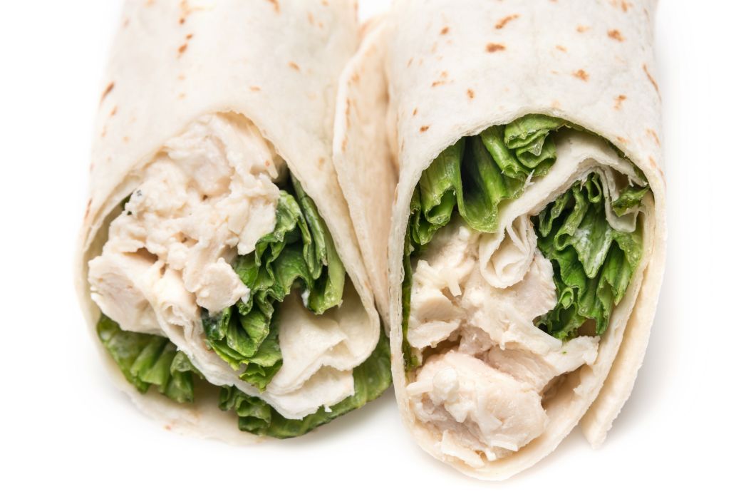 Chicken salad wraps with lettuce in flour tortillas.